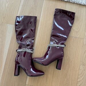 Burgundy red knee high chain boots
